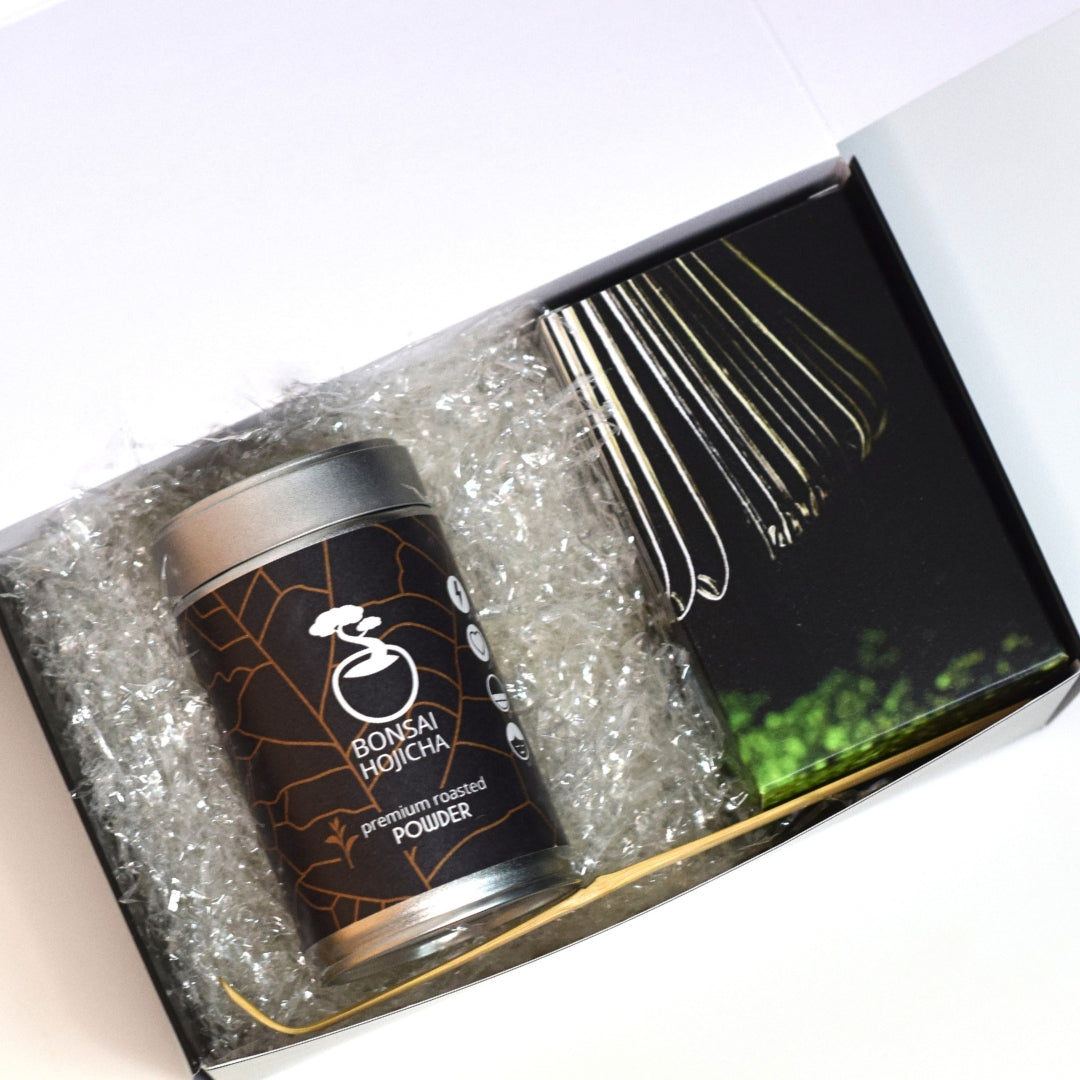 Bonsai Hojicha tea canister with packaging on a white background