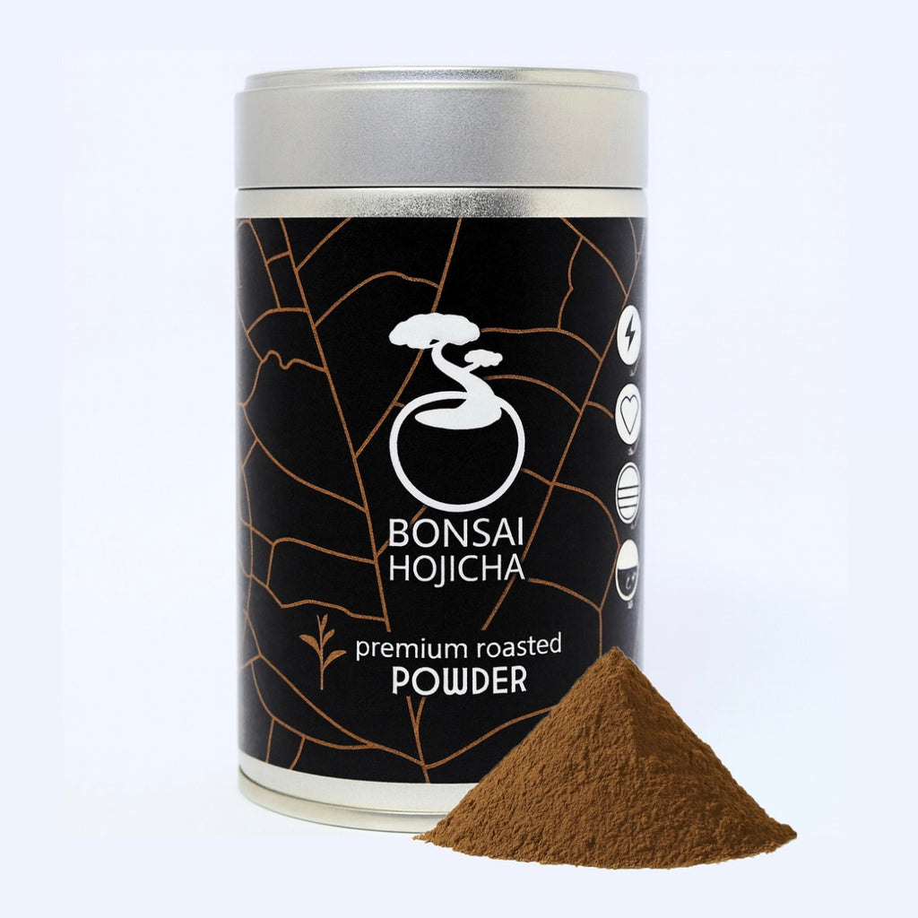Premium roasted hojicha powder tin with a mound of finely ground hojicha in front