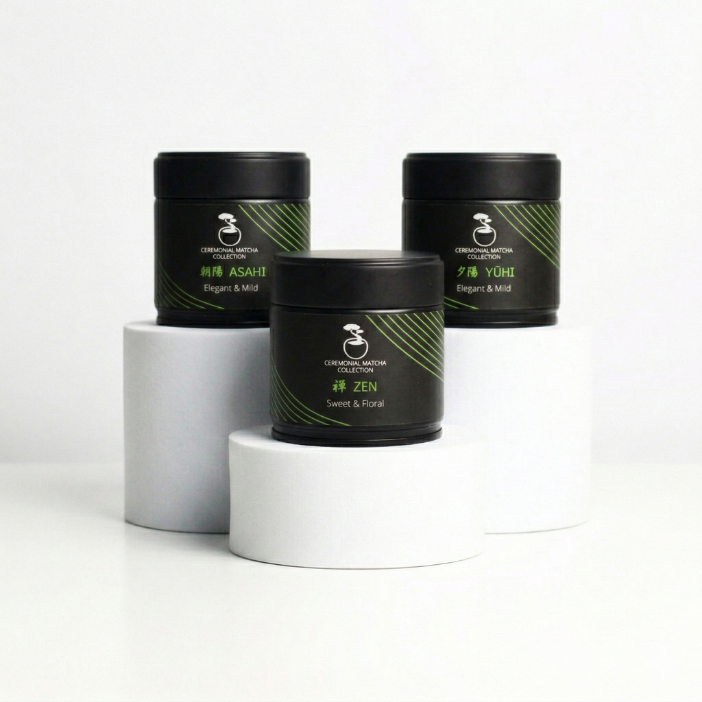 Three black tins of Bonsai Matcha Ceremonial Collection, featuring Asahi, Zen, and Yuhi blends, displayed on minimal white pedestals against a clean white background