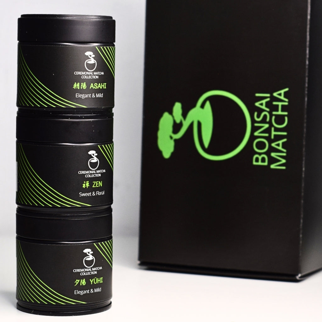 Bonsai Matcha gift set with Asahi, Zen and Yuhi ceremonial matcha tins stacked beside branded box

