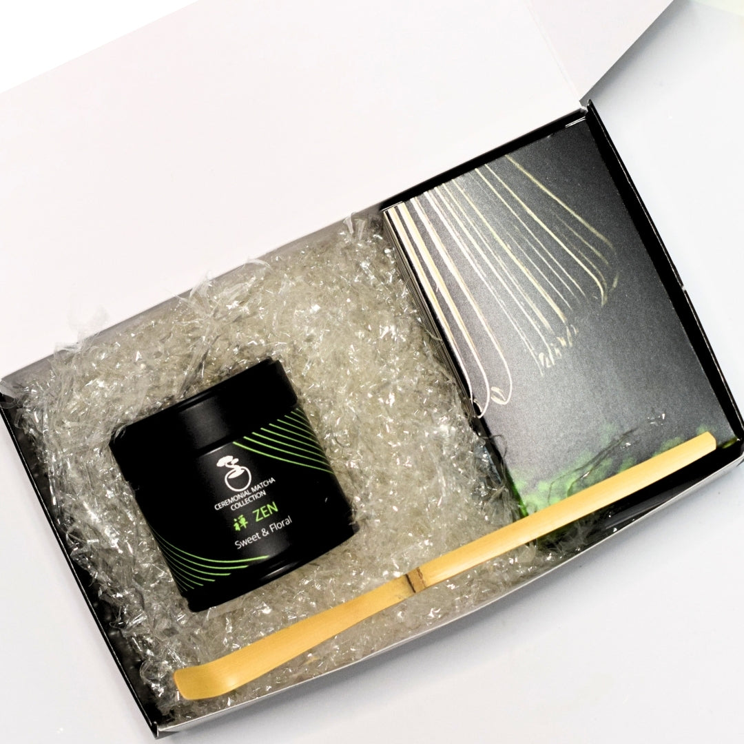 Matcha starter kit unboxing with Japanese ceremonial grade matcha, bamboo whisk, scoop and accessories inside premium gift box
