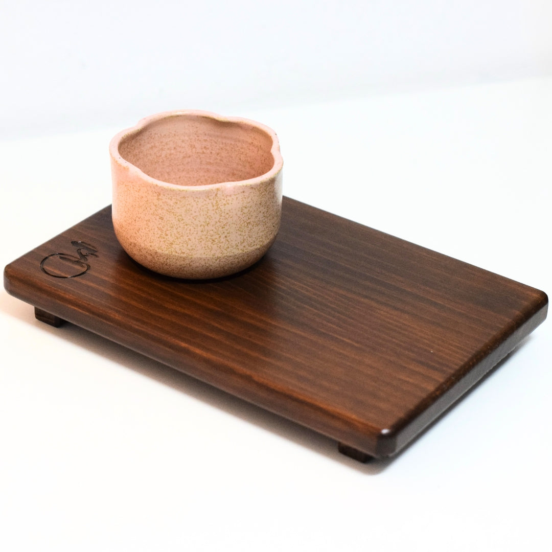 Ceramic matcha chawan on wooden serving tray, Japanese matcha tea accessories