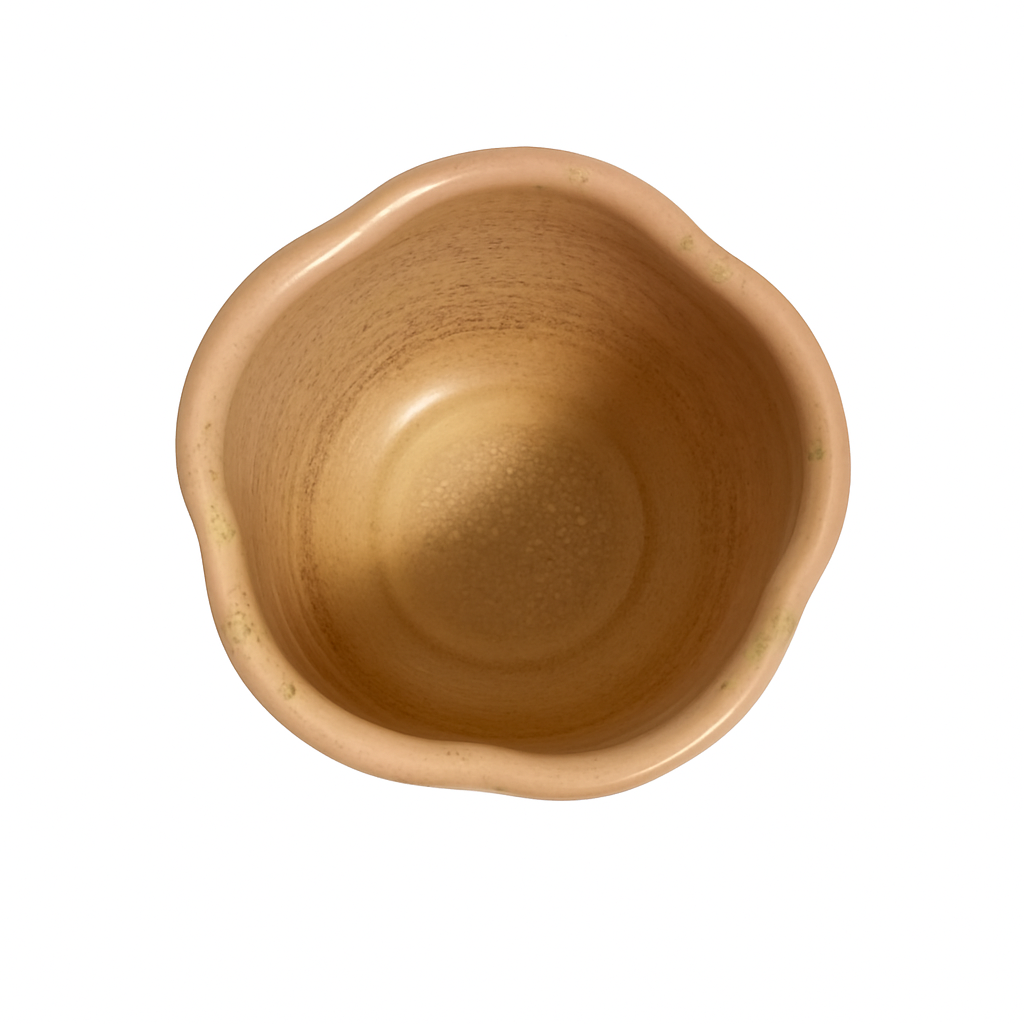 top-view-of-pink-sakura-shaped-ceramic-matcha-bowl-with-speckled-interior