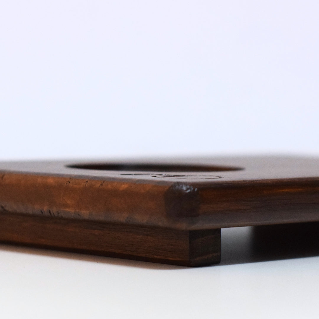 Handcrafted wooden tray for matcha, side view showing raised base and premium wood finish